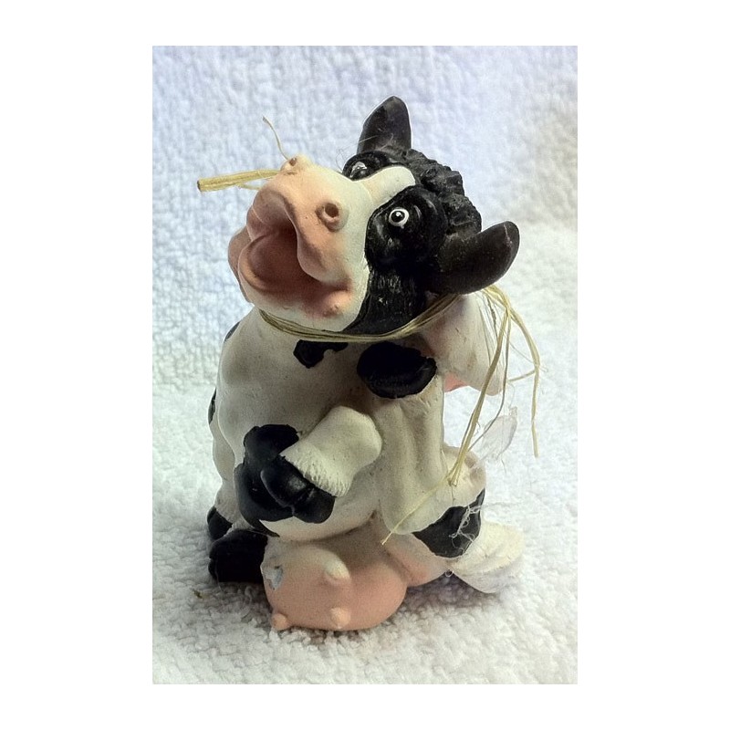 Petite vache en terre cuite