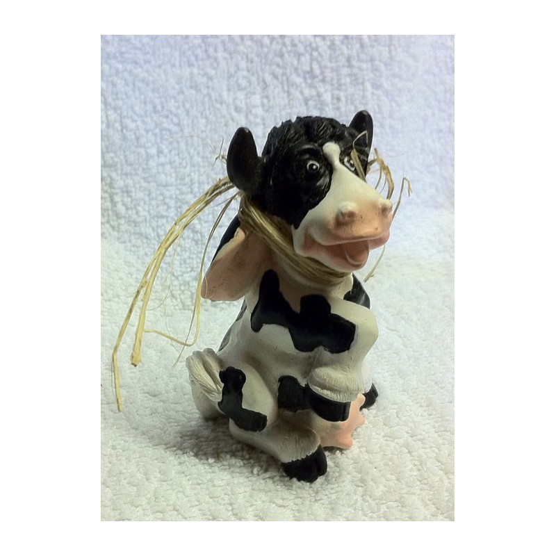 Petite vache en terre cuite